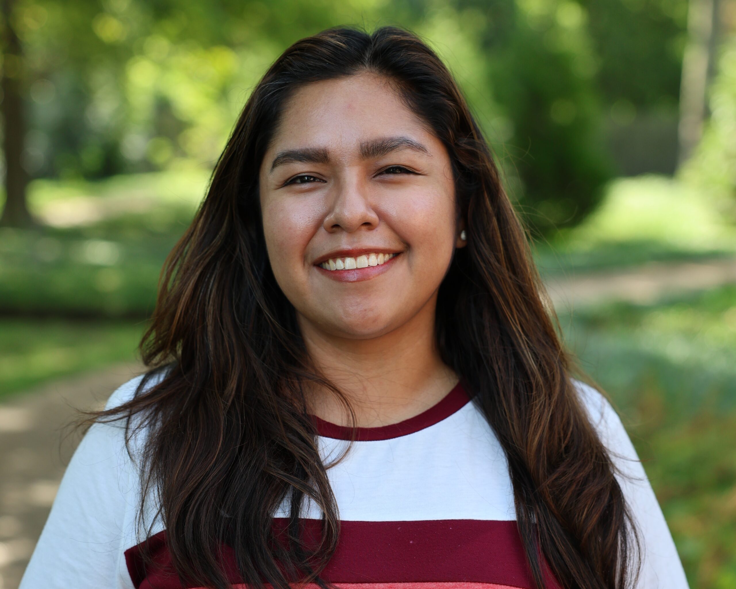 Smiling NATIVation Counseling team member outdoors