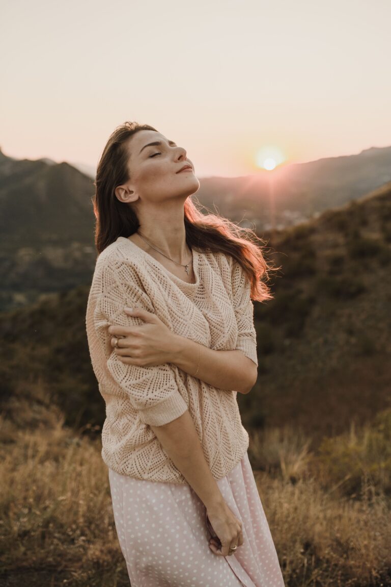 Woman sitting with her eyes closed, feeling an ache she can't quite reach
